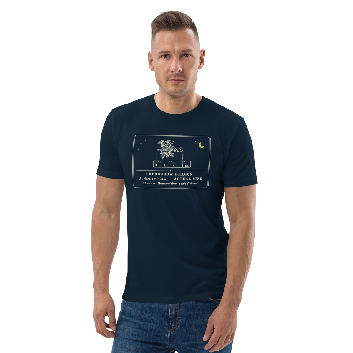 Model wearing the Hedgerow Dragon (Actual Size) tee in French Navy, engraved tiny dragon on a bramble twig at centre chest