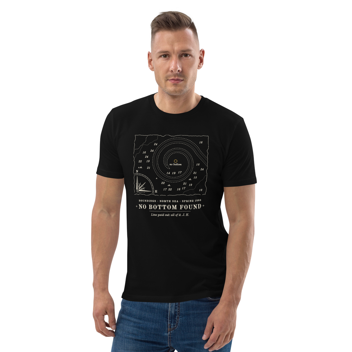 Model wearing the No Bottom Found tee in Black, the chart fragment and gold no-bottom mark at centre chest