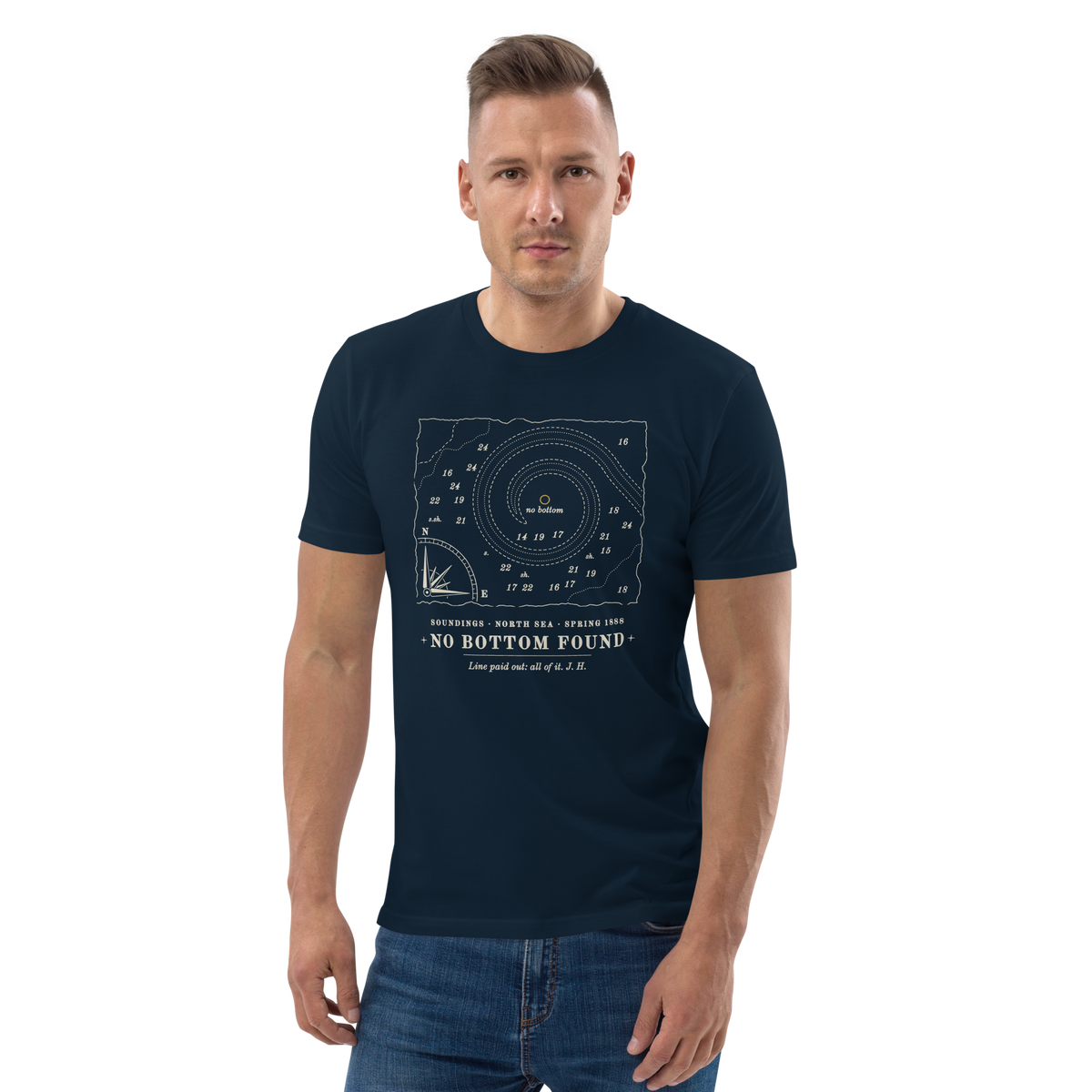 Model wearing the No Bottom Found tee in French Navy, the chart fragment and gold no-bottom mark at centre chest