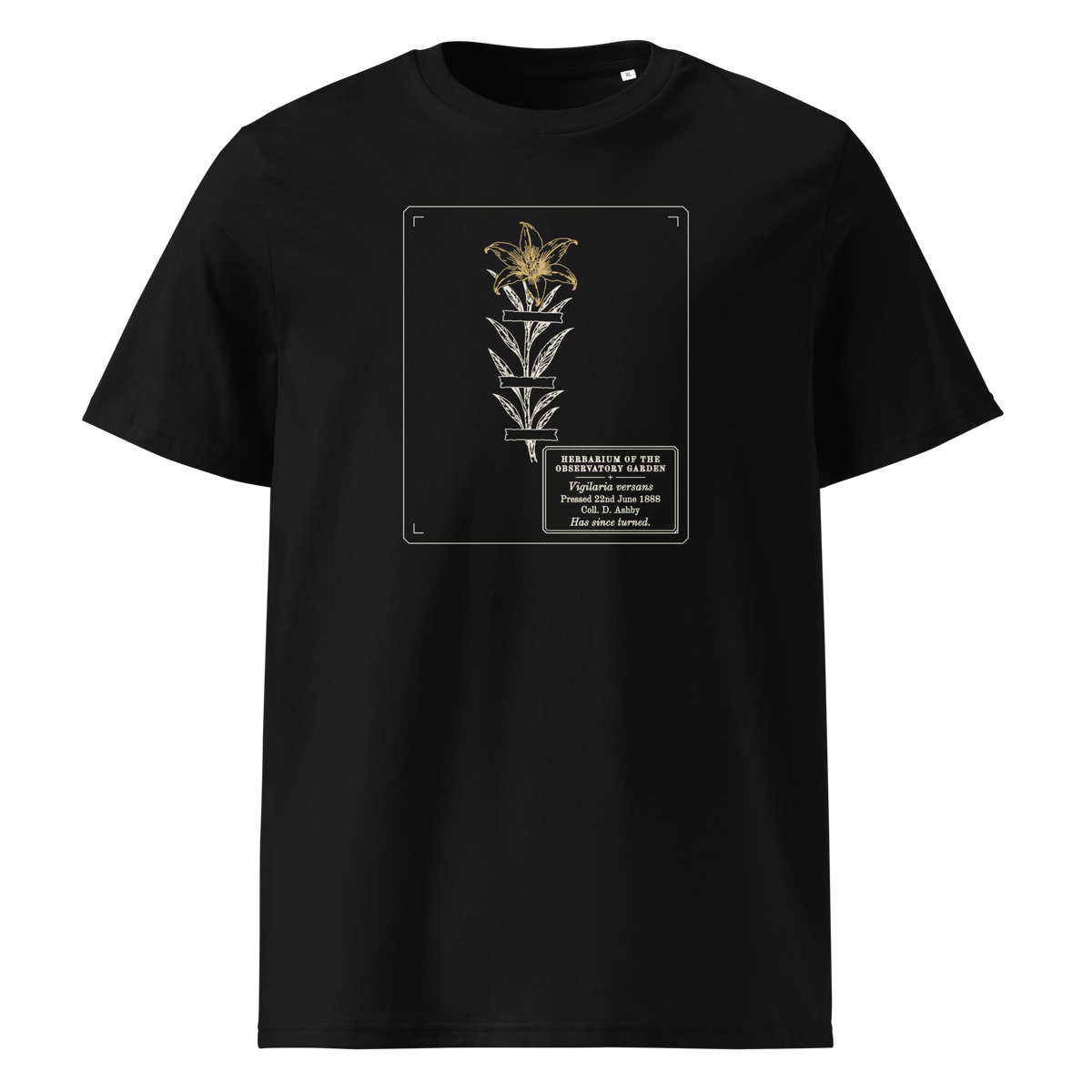 Pressed, Still Turning tee in Black, front view, the pressed flower and gold flower head at centre chest