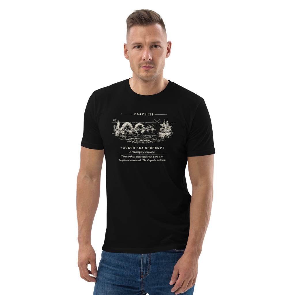 Model wearing the Three Arches, Starboard Bow tee in Black, the engraved sea serpent and ship at centre chest