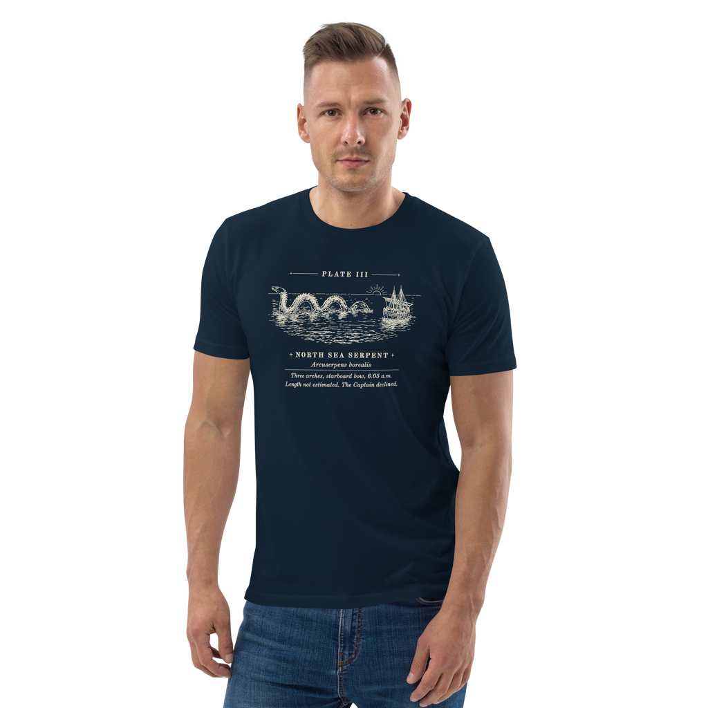 Model wearing the Three Arches, Starboard Bow tee in French Navy, the engraved sea serpent and ship at centre chest
