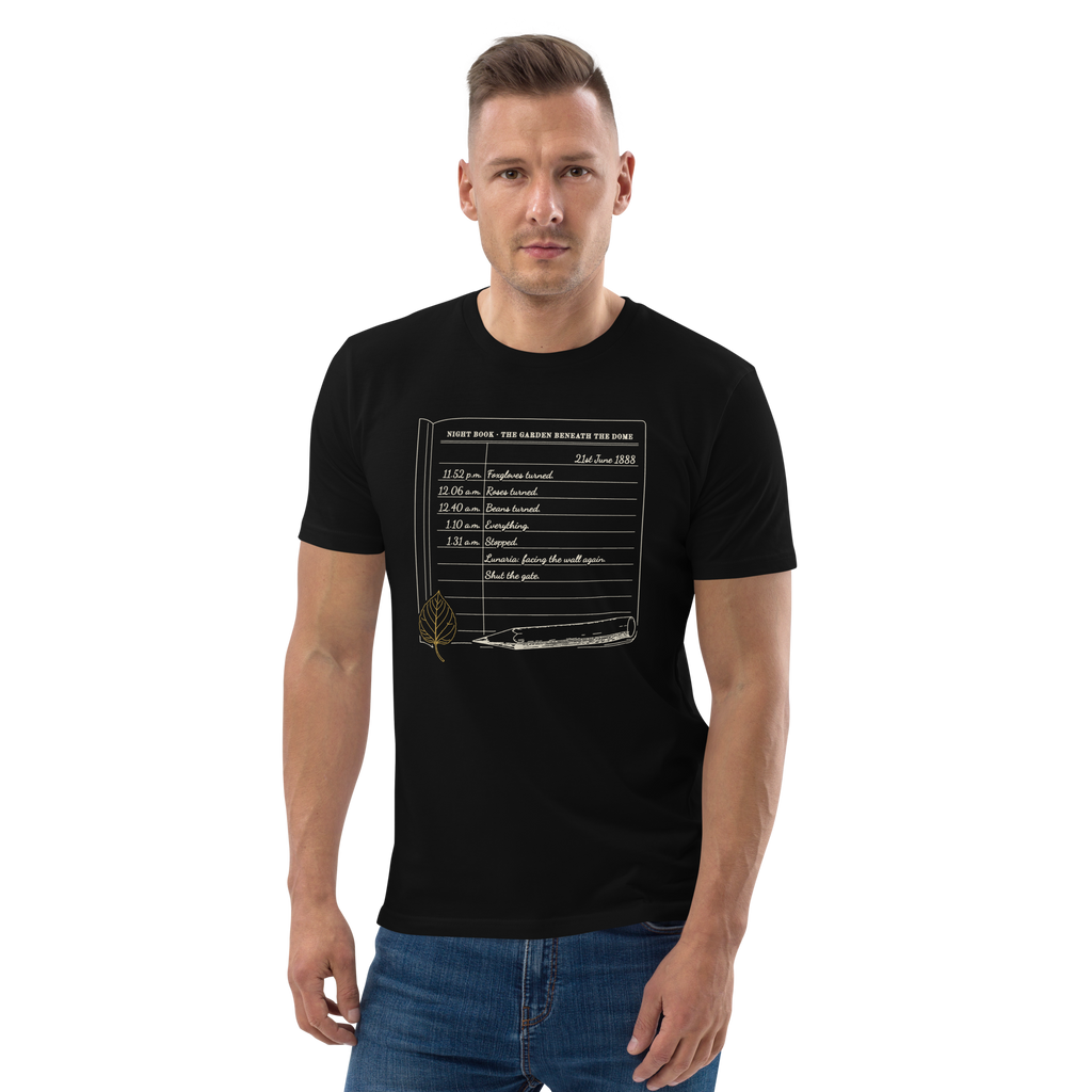 Model wearing the Night Book, Midsummer 1888 tee in Black, the notebook page and gold leaf at centre chest