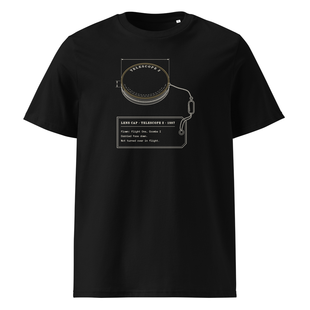 Lens Cap, Flown tee in Black, front view, the tethered lens cap and flight tag at centre chest