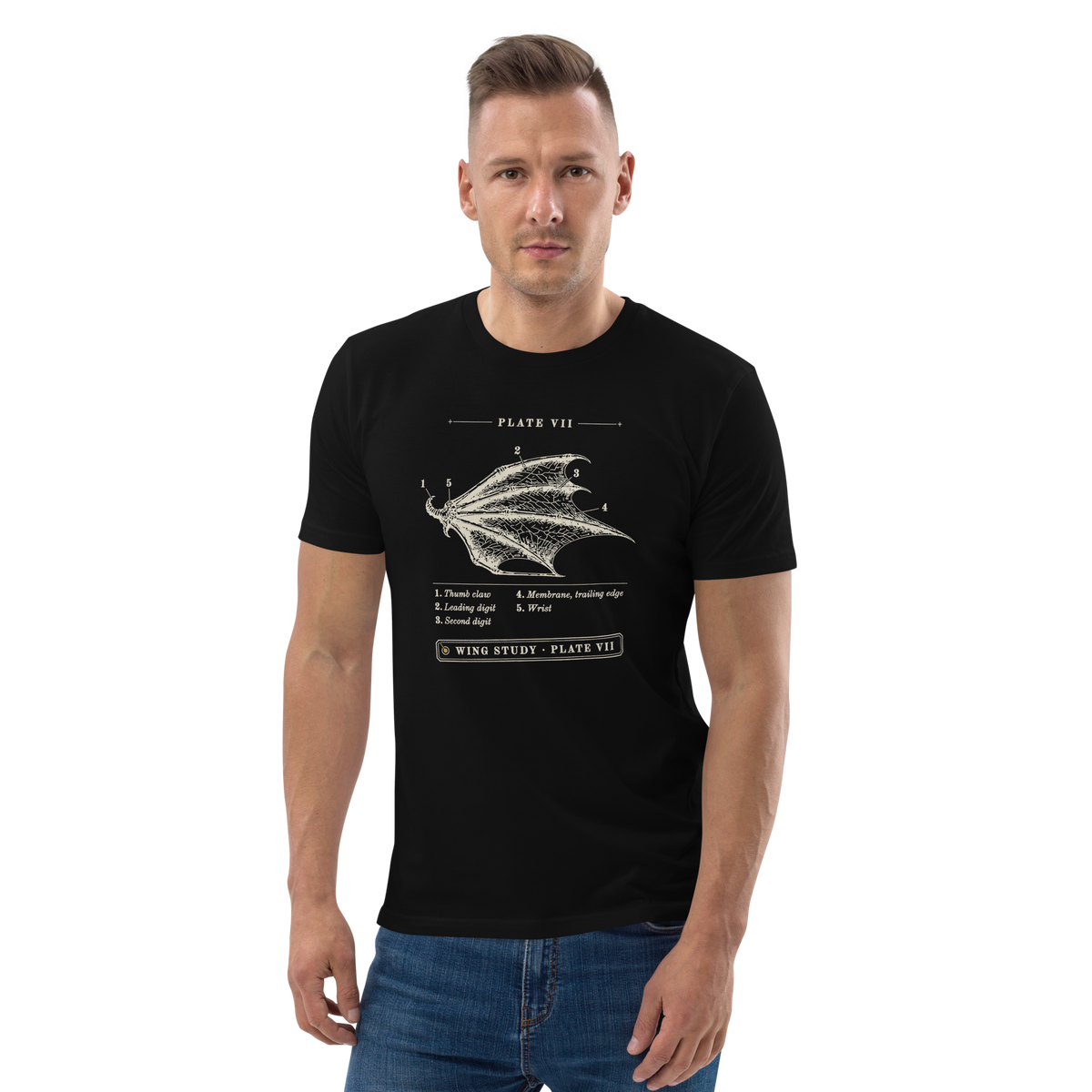 Model wearing the Wing Study, Plate VII tee in Black, engraved dragon wing with five numbered callouts at centre chest
