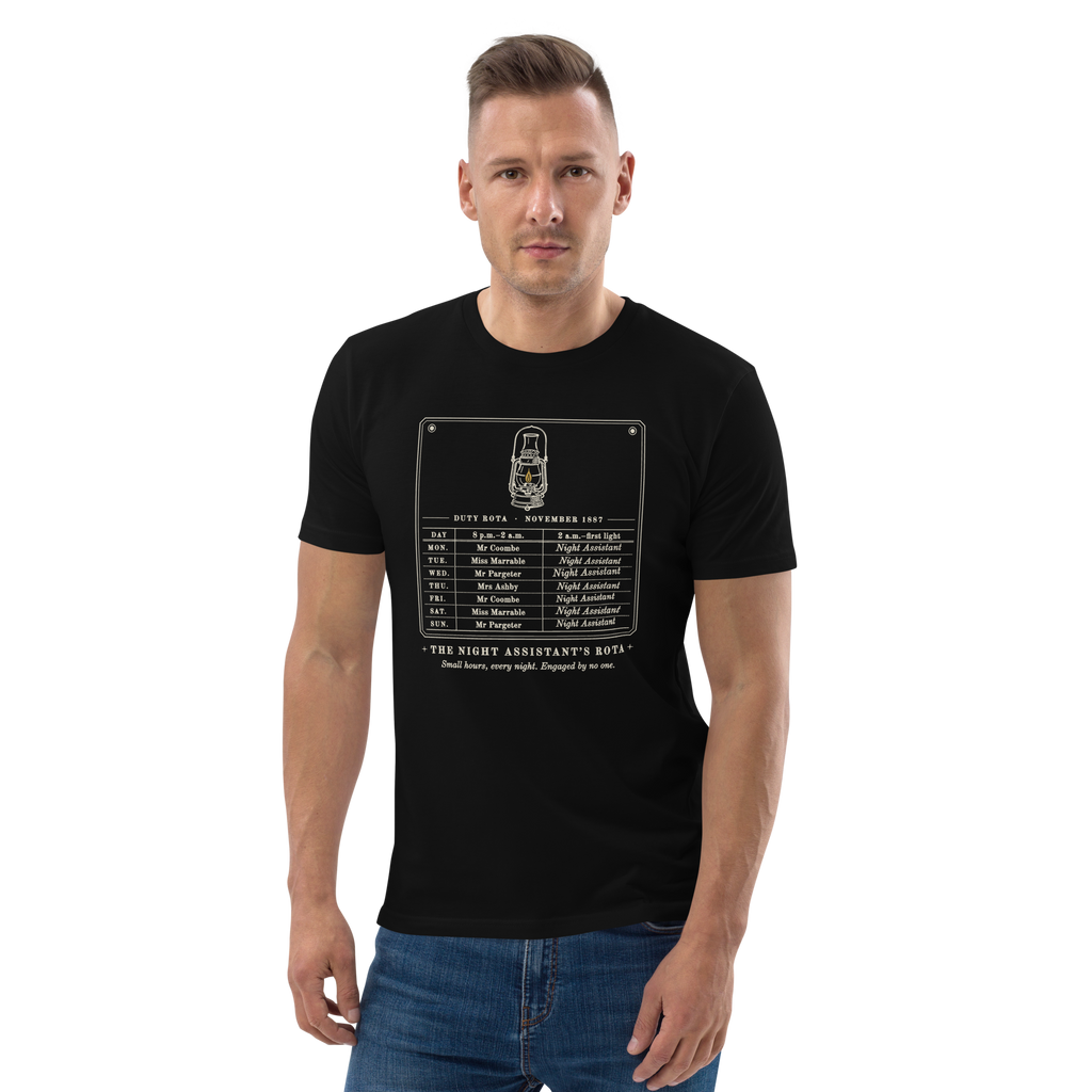 Model wearing The Night Assistant's Rota tee in Black, the rota and gold lantern at centre chest