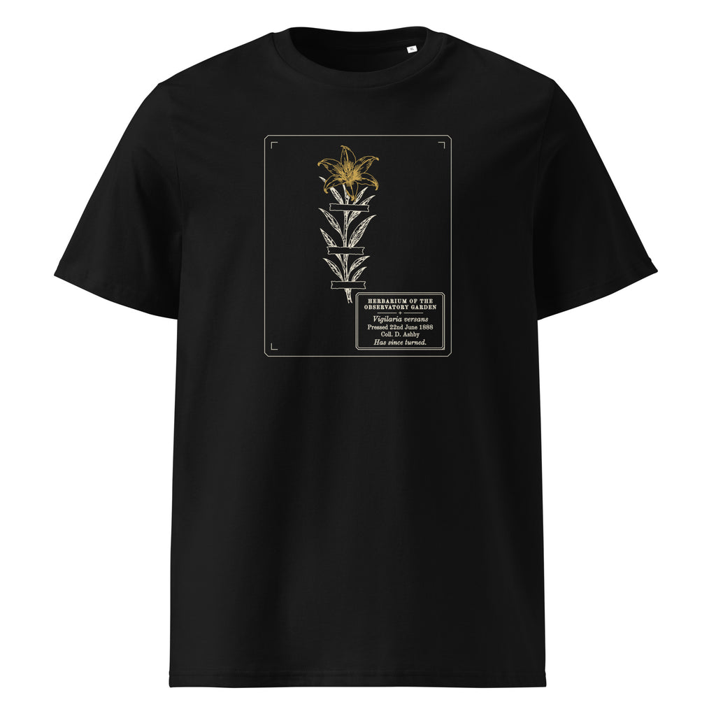 Pressed, Still Turning t-shirt in Black: herbarium sheet, a taped pressed flower with its gold head turned to the top